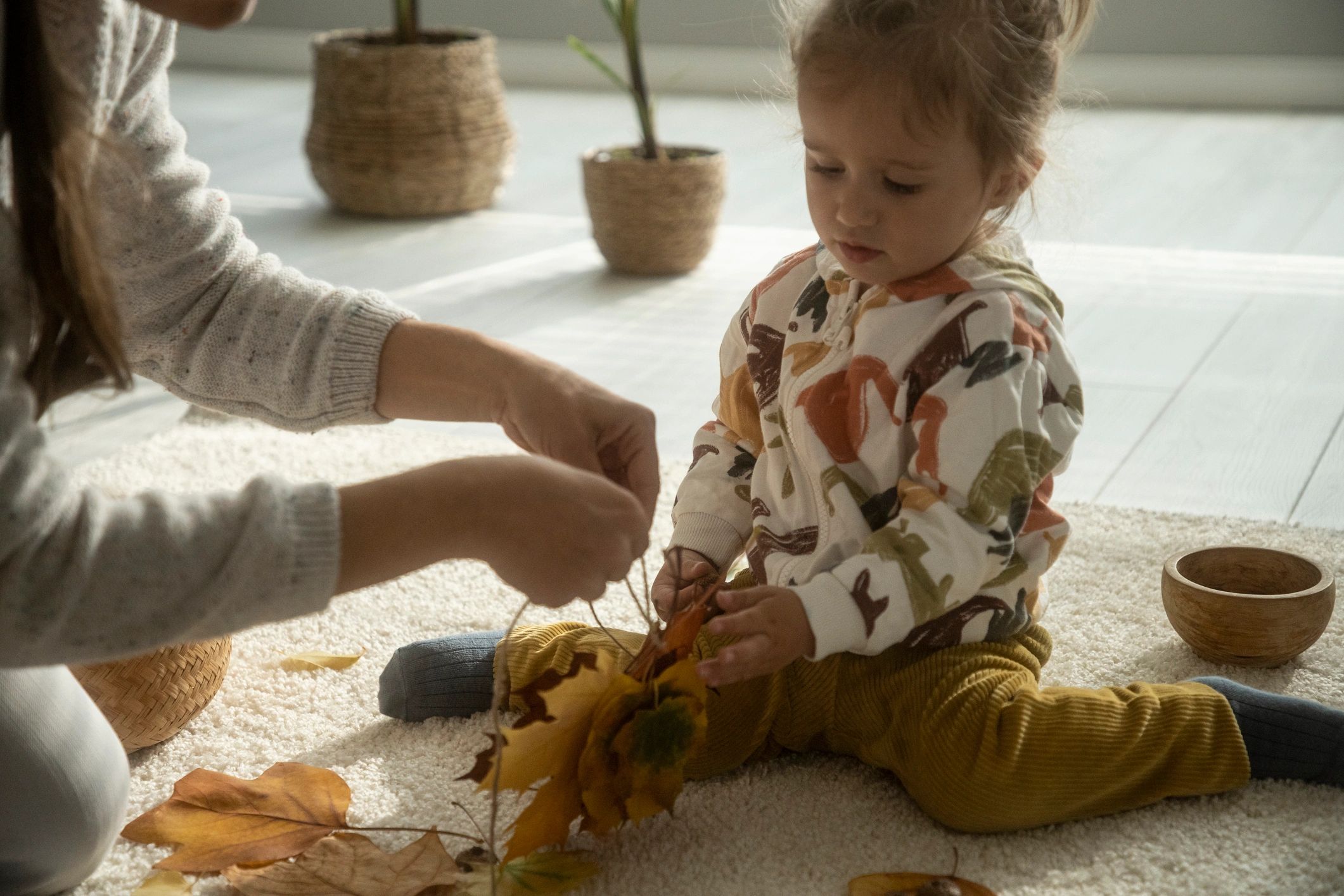 Parent and child doing a simple craft activity together at home